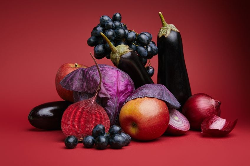 a bunch of similarly colored red and purple fruit